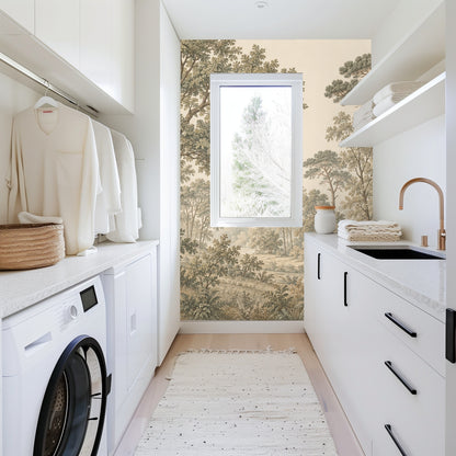 Kitchen vignette: close-up of mural behind a countertop with jug and cake, showing detailed foliage and trunk texture.