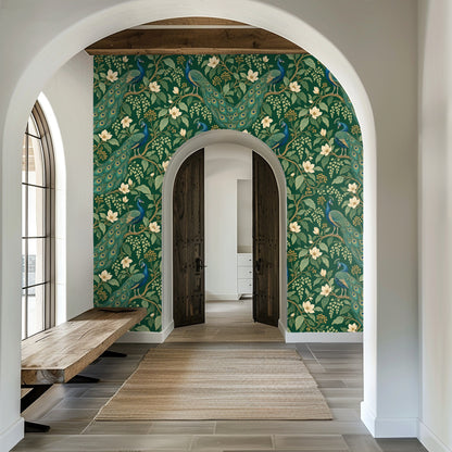 Laundry nook with washer and dryer beneath a window, wallpaper used as a bold backdrop behind shelving