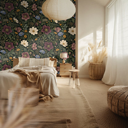Wall mockup with a wooden ladder and a cream throw draped in front of the Nocturne Herbarium wallpaper showing pattern scale and repeat.