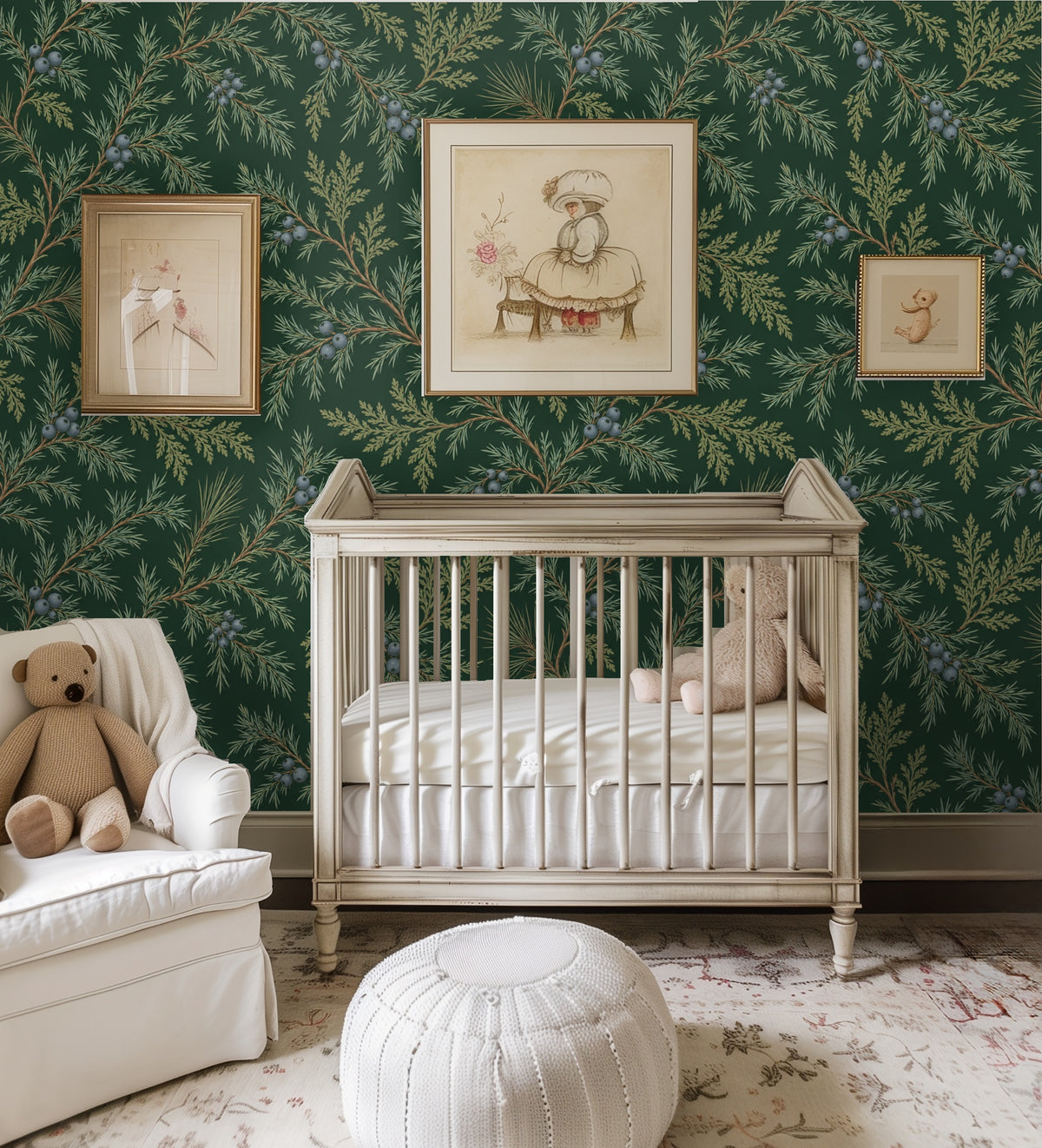 Nursery wall dressed in Juniper Drift wallpaper behind a vintage crib and framed prints, pattern adding classic botanical charm