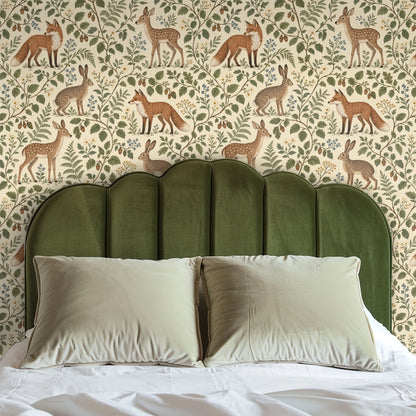 Headboard bedroom shot with an olive green upholstered headboard against Hazelwood Tales, illustrating the pattern as a headwall.