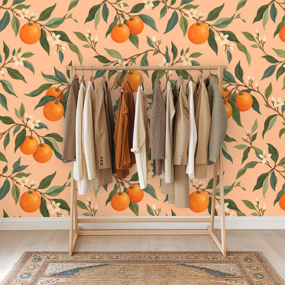 Living room with an apricot orchard mural behind an orange velvet sofa and a patterned orange rug.