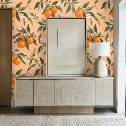 Entryway vignette with the citrus wallpaper behind a low console and framed art.