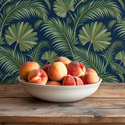 Sectional view of the wallpaper filling a kitchen or dining nook with a deep indigo background and green fronds