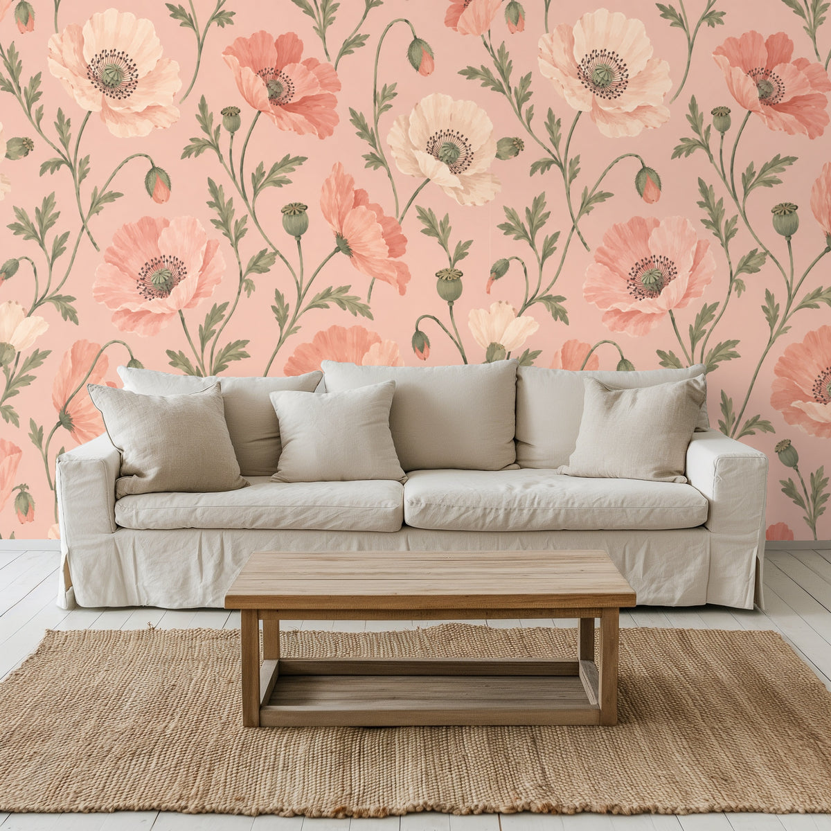 Living room wall dressed in the blush poppy design behind a neutral slipcovered sofa and natural wood coffee table.