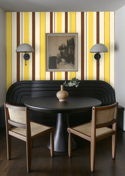 Kitchen-style still life in front of the stripe wallpaper with lemons and a pitcher emphasizing the design’s sunny color story