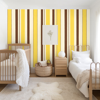 Bedroom with a full-height accent wall covered in Cocoa Ribbon Stripe, warm sunlight, natural woven textures and low wooden bed