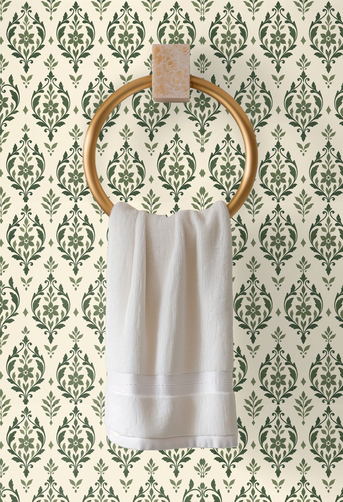 Bright minimal space with full-wall sage arabesque mural and sculptural decor in foreground