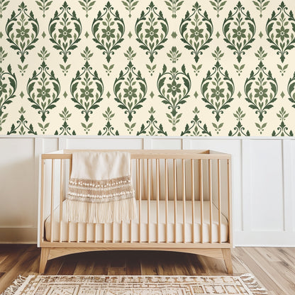 Living room with white sofa and patterned sage arabesque wallpaper framed by arched doorway