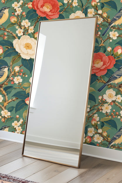 Wallpaper detail showing branches with pink camellia buds and white blossoms against teal