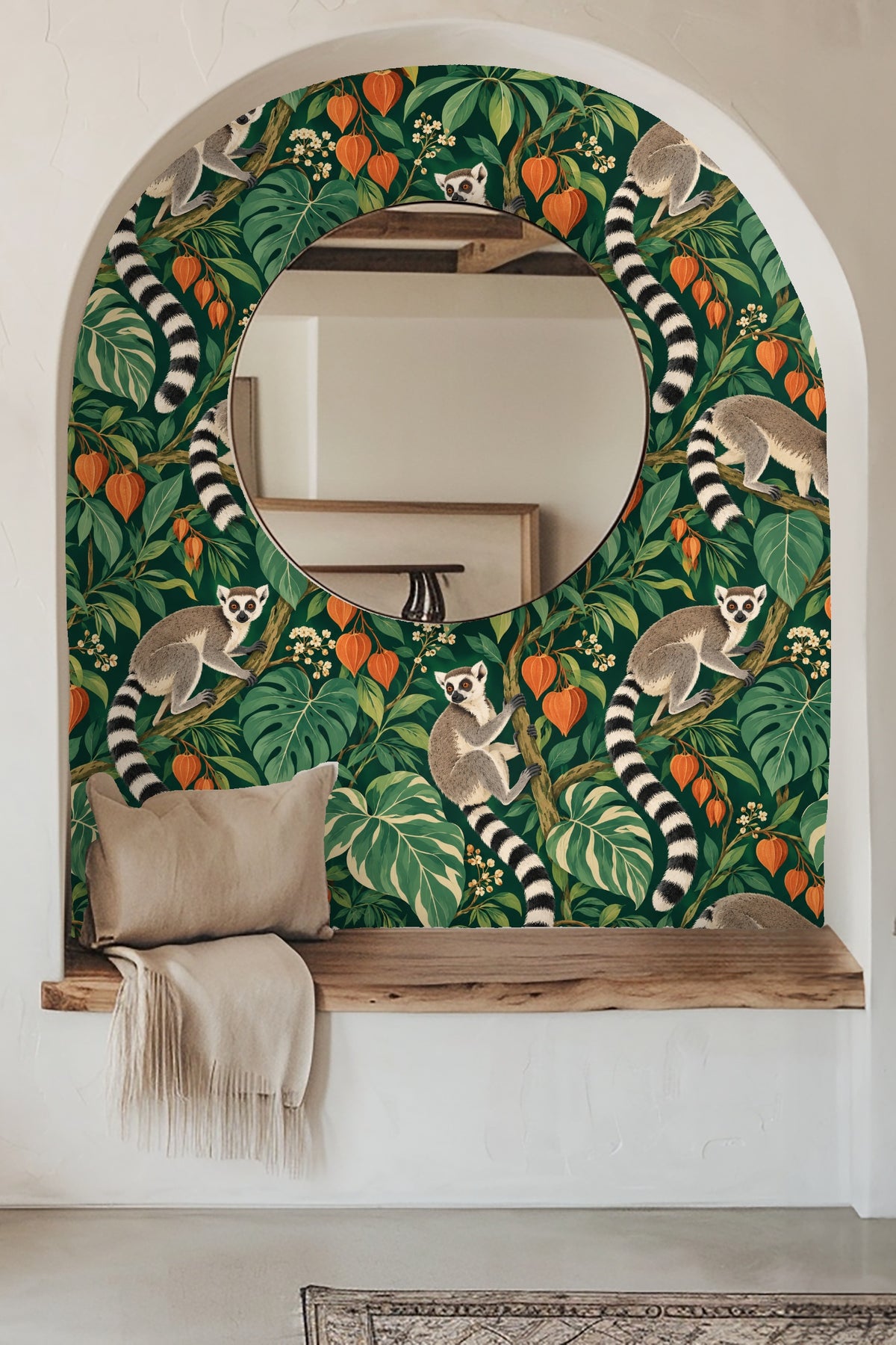 Wallpaper detail showing three ring-tailed lemurs perched in lush green foliage with orange lantern-like flowers.