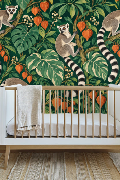 Close view of lemur wallpaper beside a wooden picture frame on a white wall.