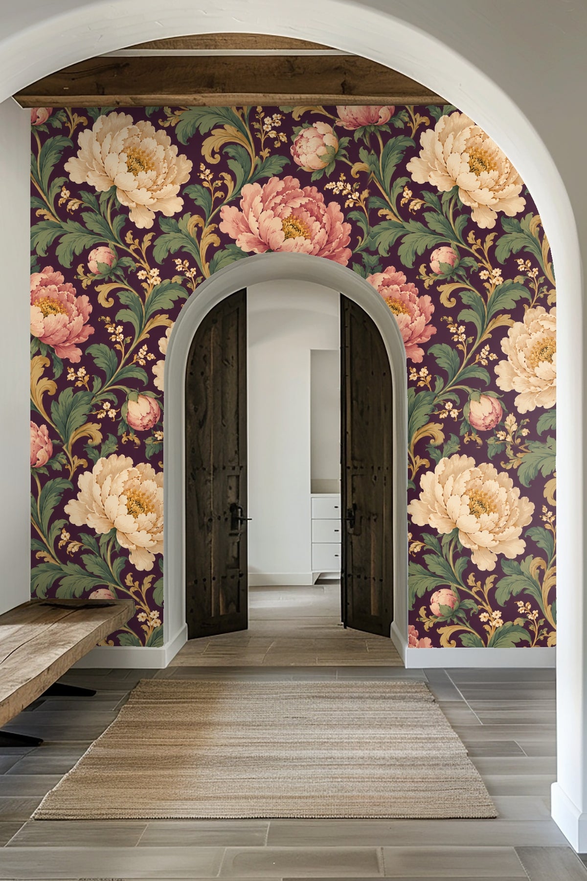Laundry room with plum peony wallpaper, white washer and dryer under wooden countertop and floating shelves.