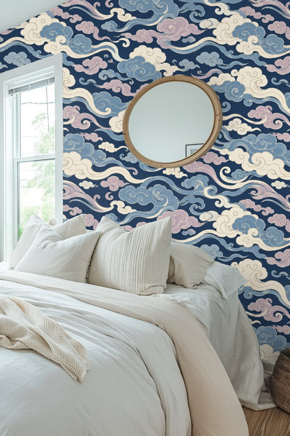 Side view of hanging rattan chair against the intricate cloud wallpaper pattern.
