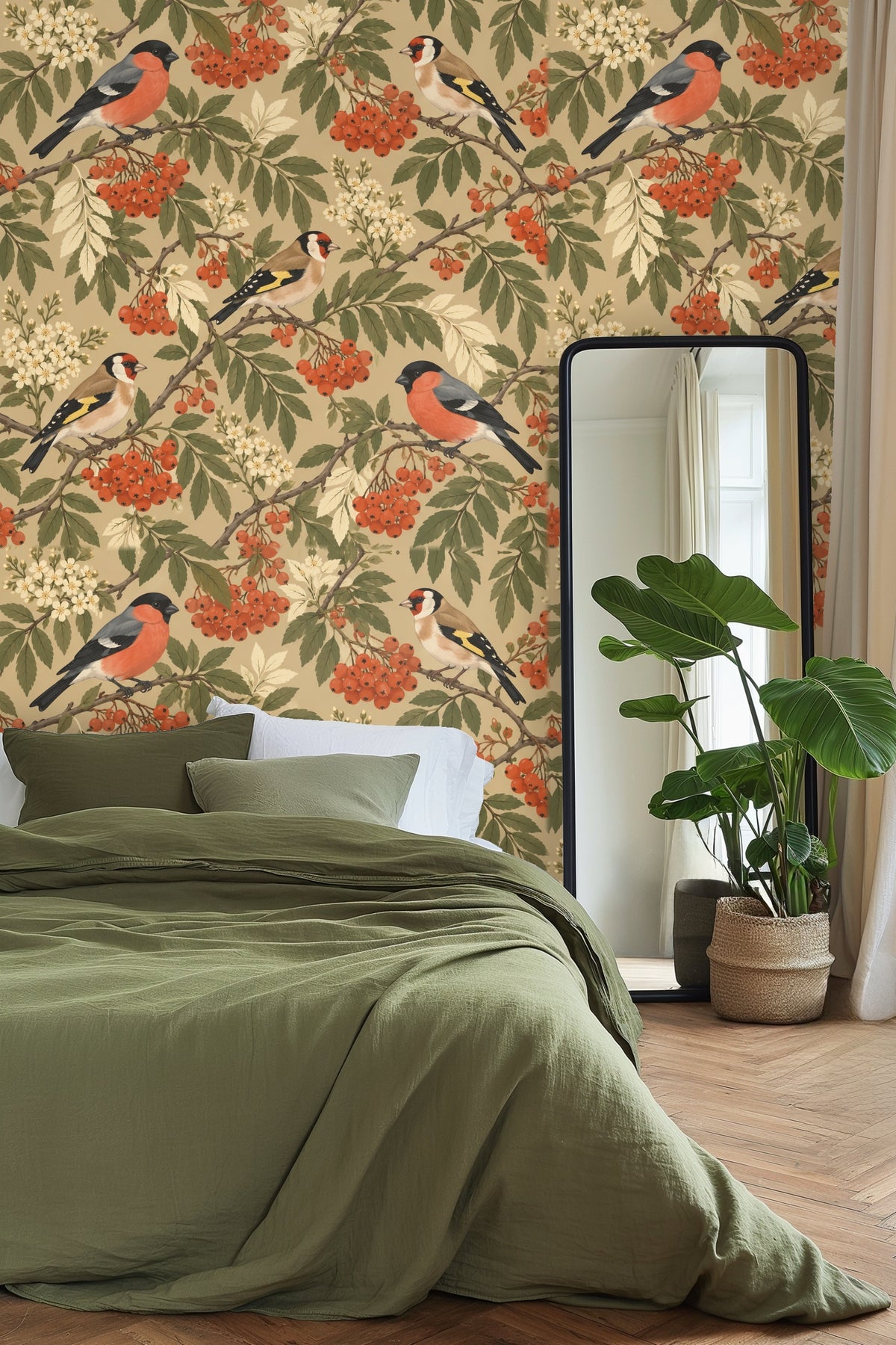 Living room with Rowan Birds Wallpaper behind a mustard velvet sofa and orange pillows with blue stool