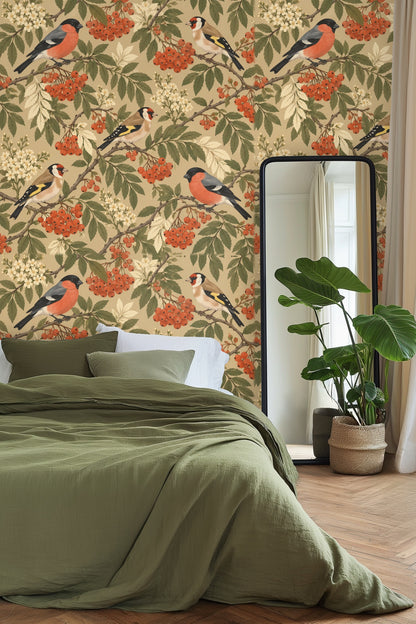 Living room with Rowan Birds Wallpaper behind a mustard velvet sofa and orange pillows with blue stool