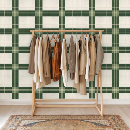 Console styling with lamp and framed artwork over the plaid, illustrating small-space application and tailored geometry.