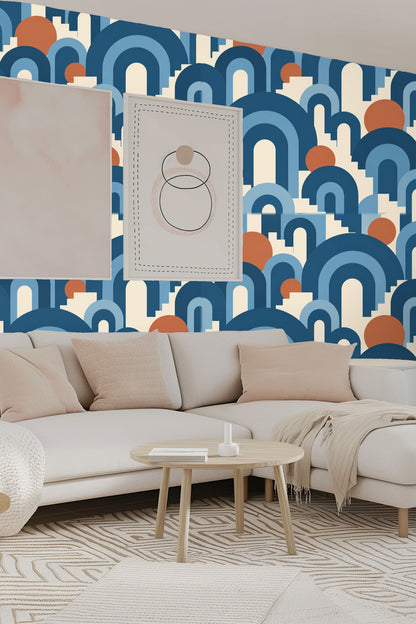 Nursery featuring the blue arch and terracotta circle wallpaper behind a light wooden crib.