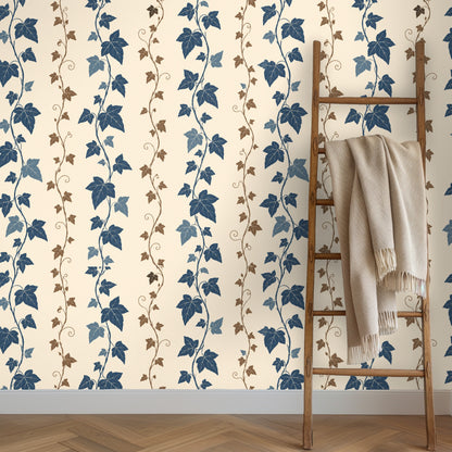 Nursery wall with wallpaper featuring vertical twining ivy stripes behind a simple wooden crib
