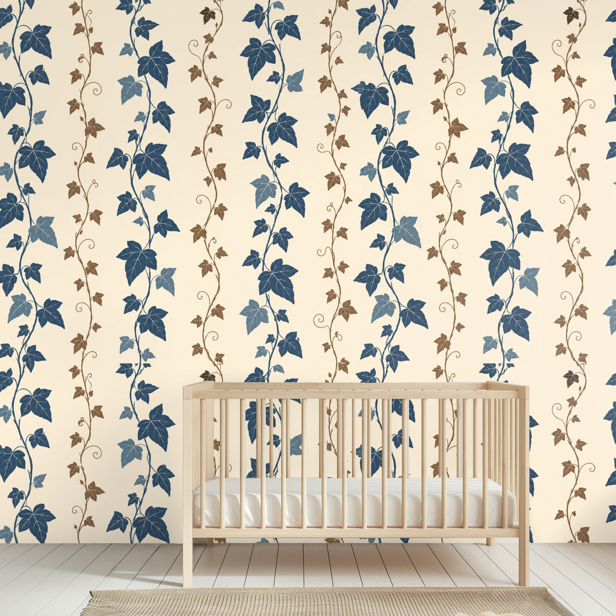 Close-up of wallpaper artwork showing cobalt ivy leaves and thin brown vines on a warm cream background