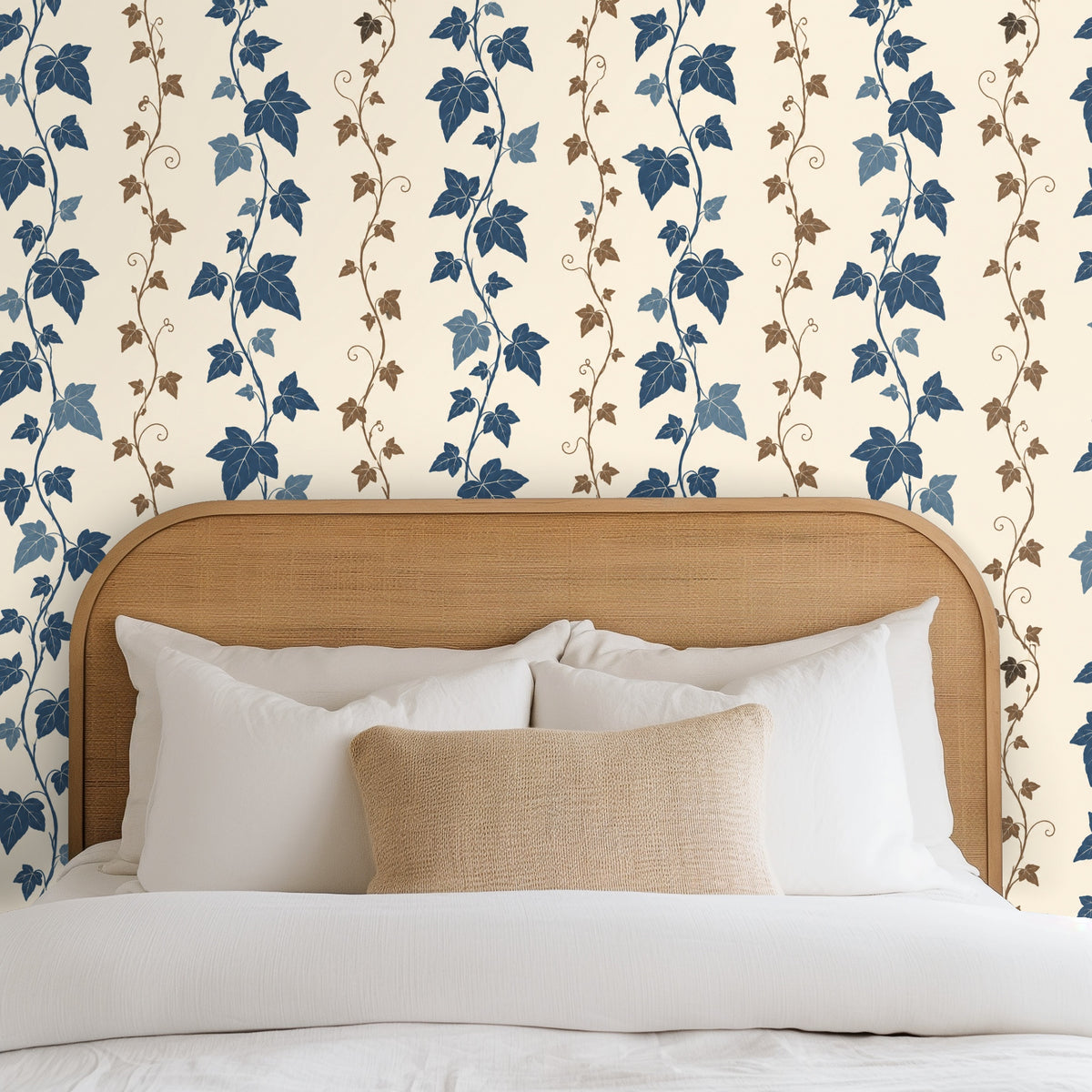 Clothing rack positioned against the wallpaper, showing scale of the cobalt leaves and brown tendrils
