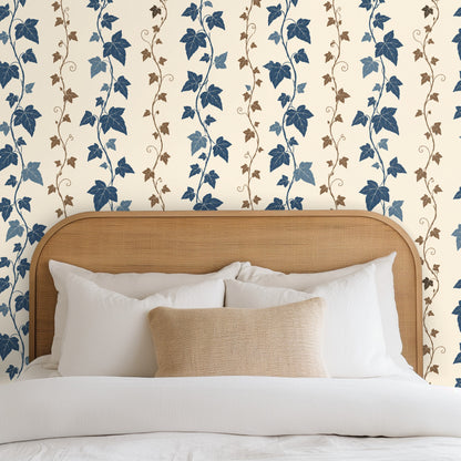 Clothing rack positioned against the wallpaper, showing scale of the cobalt leaves and brown tendrils