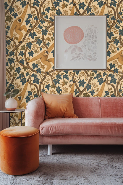 Wallpaper pattern featuring three golden gibbons swinging along twisting brown vines and blue-green ivy leaves on a beige background