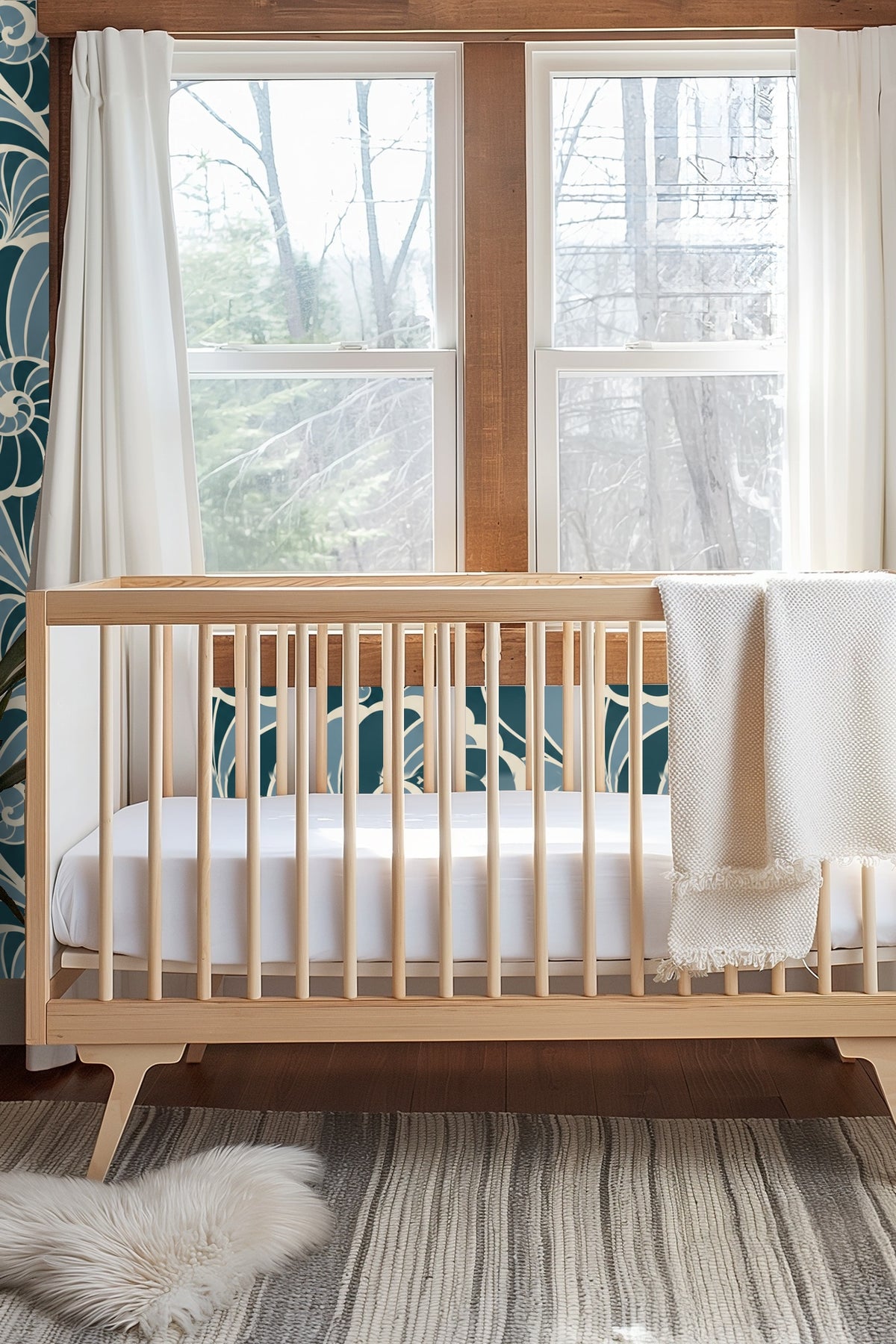 Muted creamy background contrasting with saturated teal and dusty blue shell motifs.