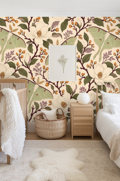 Living room wall with Moon Moth Magnolia wallpaper paired with white sofa and wooden decor elements