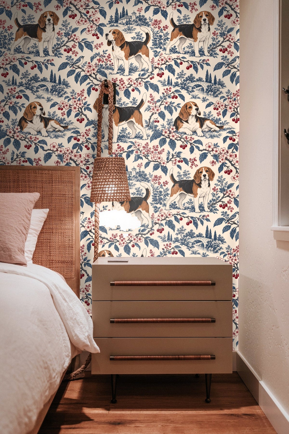 Close-up of cherries and blue leaves forming a repeating pattern with dogs and countryside elements.