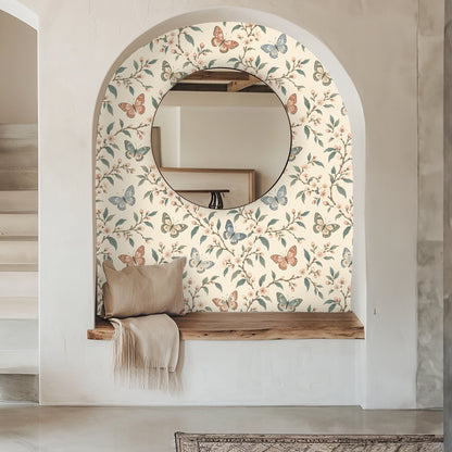 Nursery with crib placed before the wallpaper; delicate blossom clusters and butterflies create a calm, whimsical backdrop
