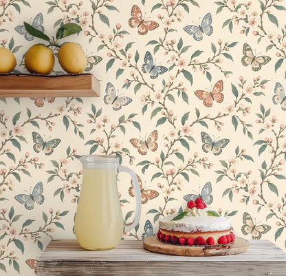Arched entryway niche lined with the wallpaper and a round mirror, demonstrating pattern in a small architectural space