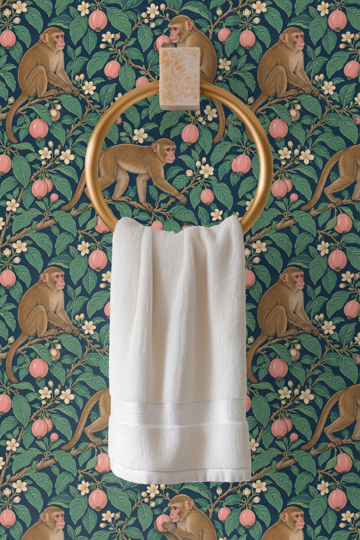 Pattern repeat showing three macaques positioned on branches laden with white blossoms and pink guavas.