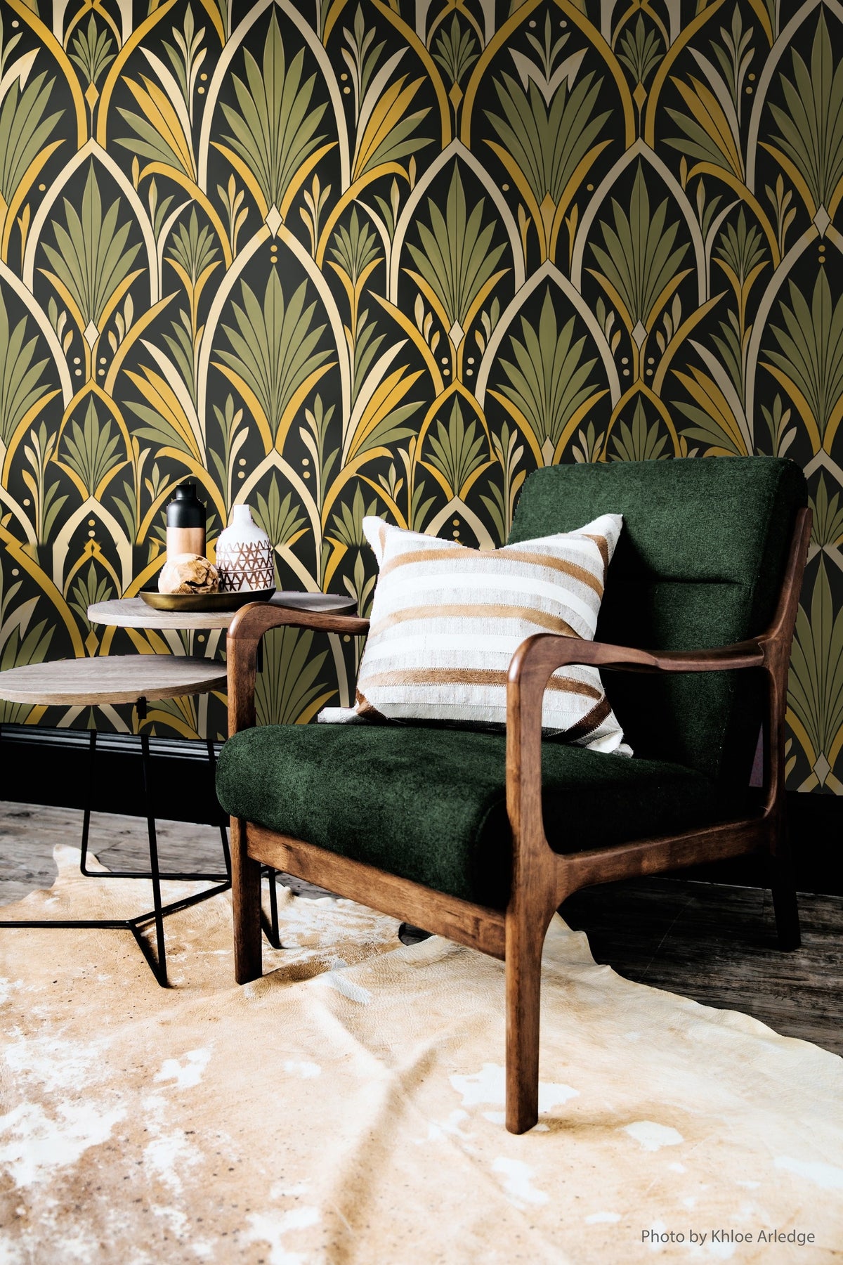 Corner photo showing wallpaper with overlapping fan leaves and minimal dot accents in cream