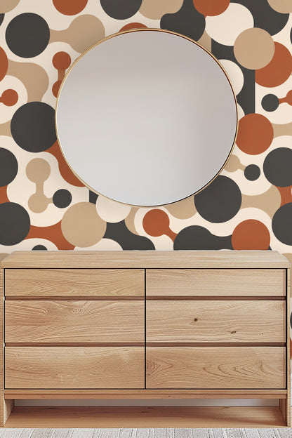 Bathroom scene with modern wood cabinet and soap bottles against Cinder Orbit Chains wallpaper backdrop.