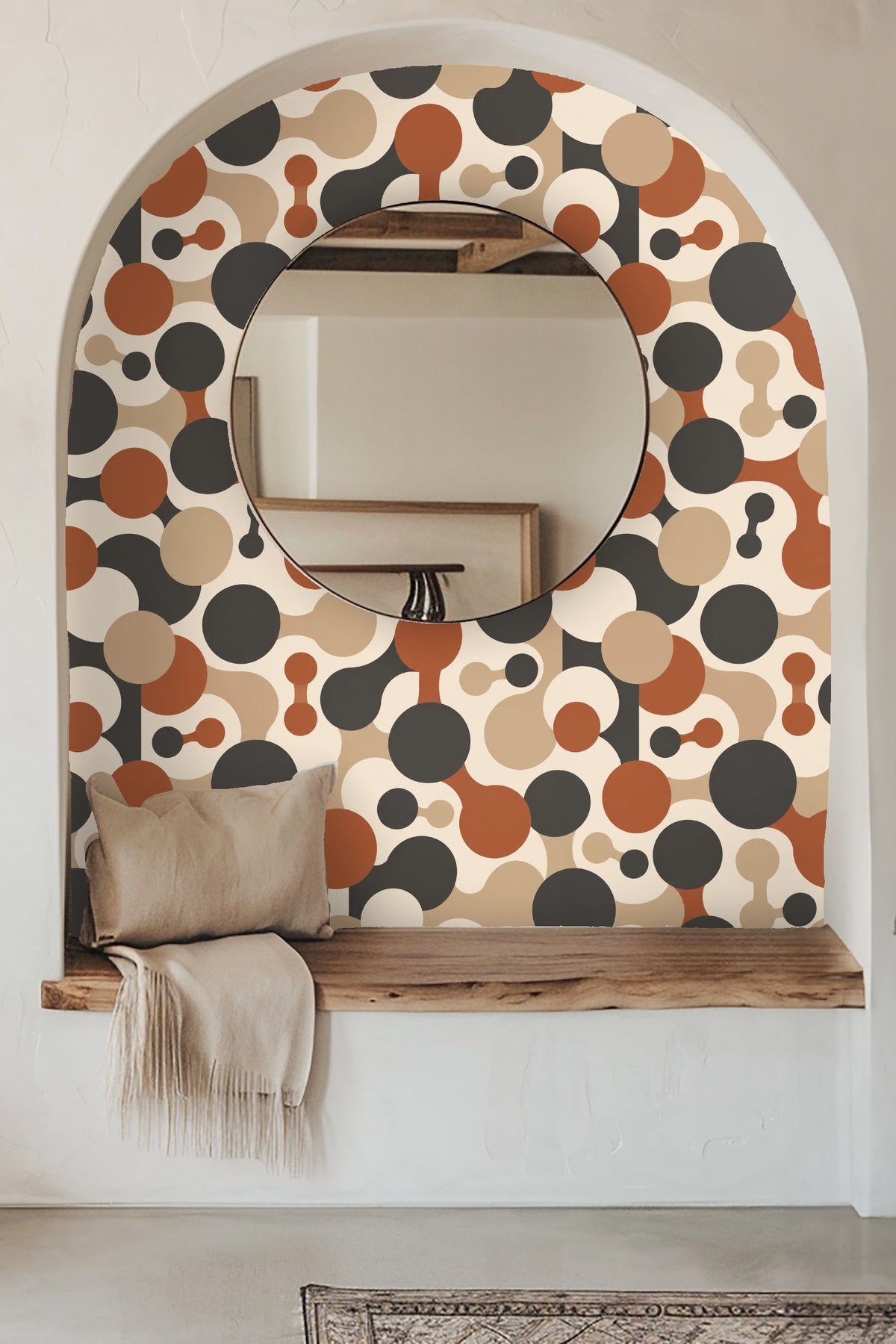 Bathroom medicine cabinet open with shelves, displaying Cinder Orbit Chains wallpaper behind in rust, charcoal, beige, and cream.
