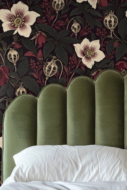Softly lit room corner featuring textured botanical wallpaper