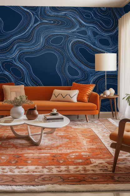 Dark indigo wallpaper with flowing light blue contour lines and copper accents, engraved pattern effect