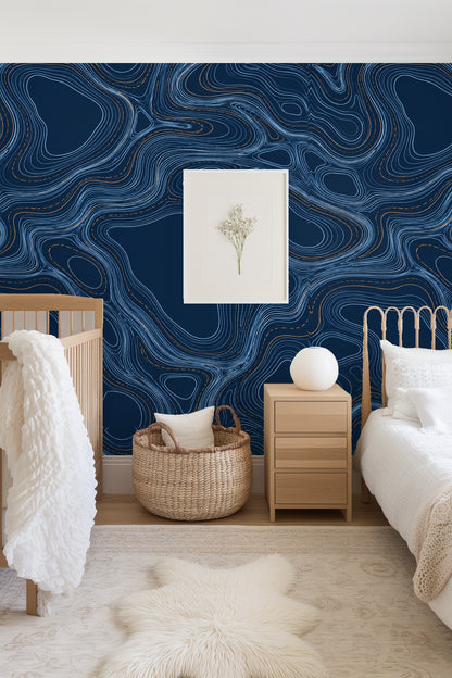 Close-up of indigo wallpaper with organic contour lines and copper detailing