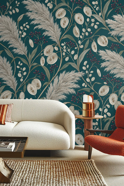 Close-up of detailed pampas grass and lunaria seed pods on teal wallpaper