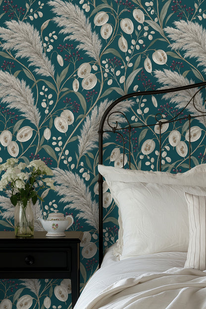 Living room view with teal pampas wallpaper behind white curved sofa and orange chair