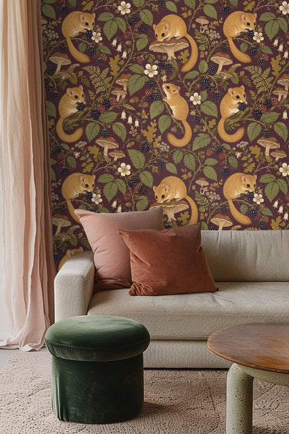 Dormouse holding a blackberry fruit within foliage on dark plum wallpaper