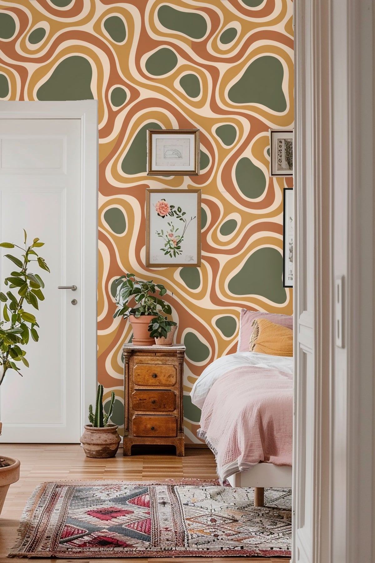 Wall section showing scaling of large and small organic forms in earthy colors.