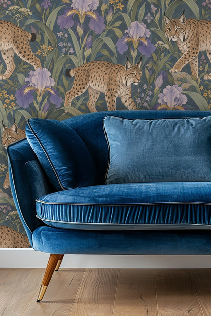Original artwork showing spotted lynxes amidst lilac iris flowers on deep blue background.