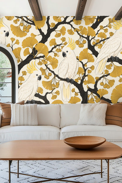 Bedroom with green velvet headboard and golden ginkgo cockatoos wallpaper behind bed