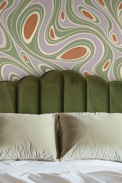 Salvia Flow Contours wallpaper as backdrop behind beige sofa with wood coffee table and natural fiber rug