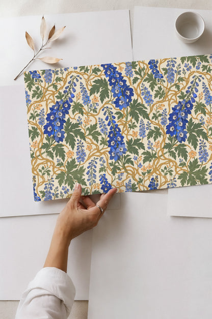Golden vine twisting through green leaves and blue floral buds