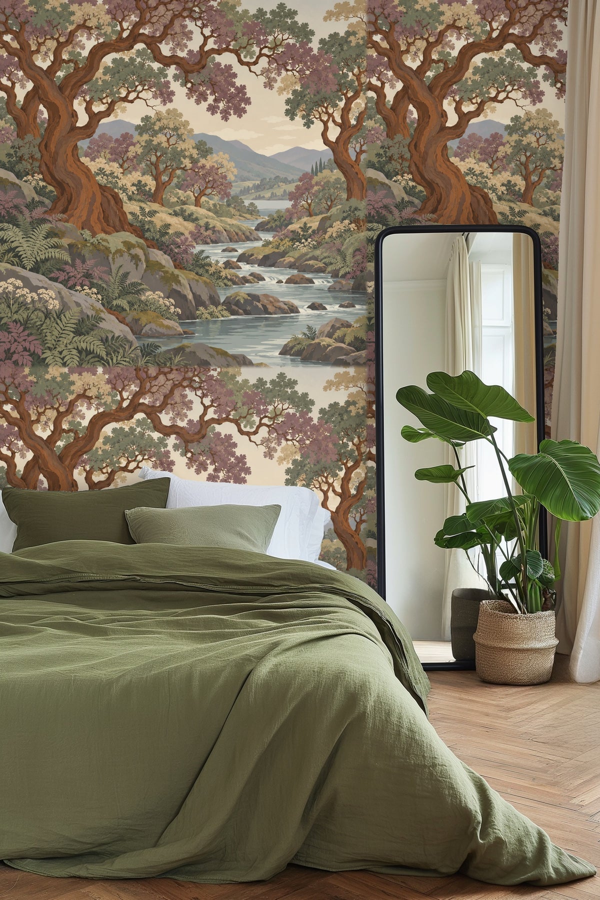 Living room with wallpaper featuring copper-barked trees over a serene stream, paired with neutral sofa and green velvet stool.