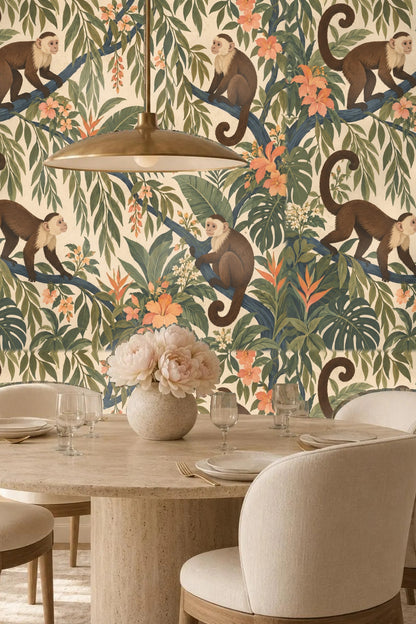 Peach colored tropical flowers and assorted green leaves interwoven throughout the wallpaper design with playful monkeys