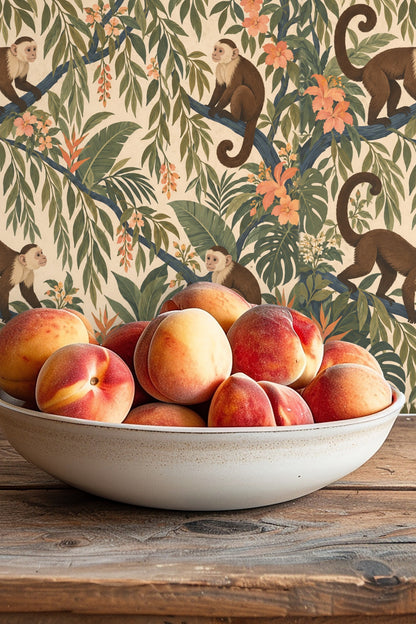 Branch with small clusters of orange-hued blossoms contrasted with dark green leaves within the wallpaper's botanical motif
